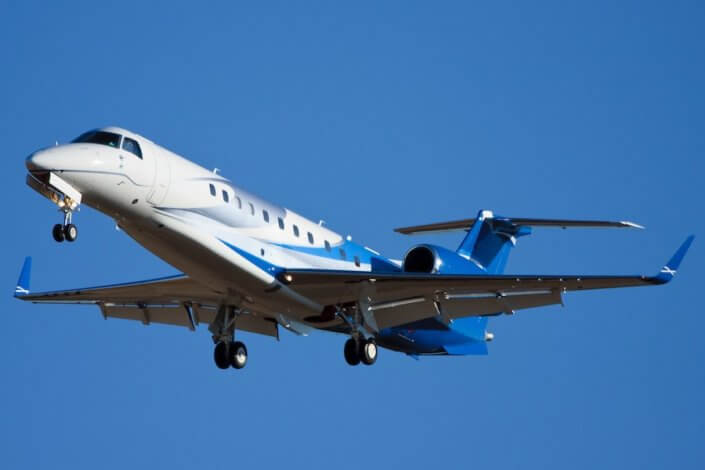 Modern Corporate Jet Landing ERJ aircraft